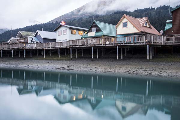 Water reflections of colorful houses early in the morning.