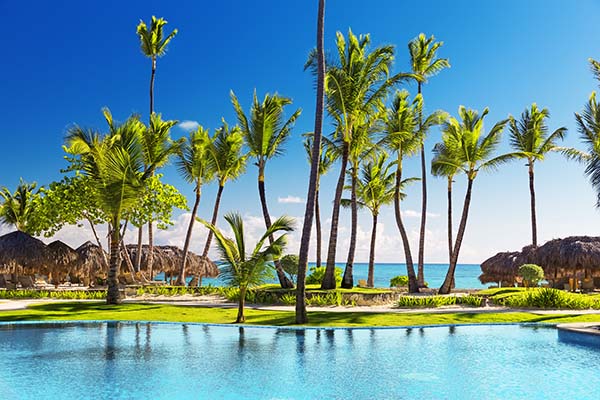 Tropical beach resort with umbrellas and lounge chairs in Punta Cana, Dominican Republic