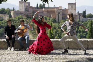 Dancers-and-musician-performing-flamenco-on-sunny-day-in-front-of-Alhambra-Granada-Spain-cm.jpg