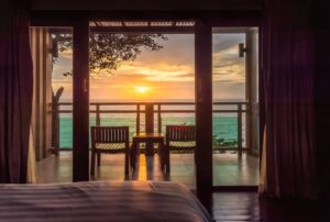 Ocean-sunset-view-from-bedroom-balcony-for-travel-concept.-cm.jpg