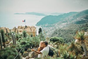Happy-millennial-couple-exploring-the-historic-village-of-Eze-in-the-south-of-France-while-on-vacation-cm.jpg
